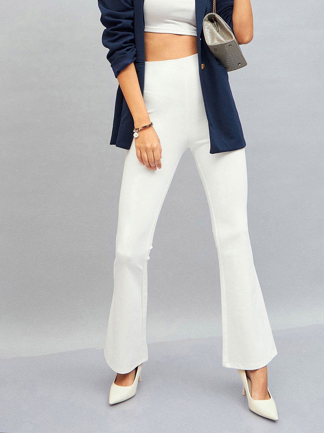 Women's Women White Bell Bottom 4-Way Stretch Pants in Rayon by Sassafras for wholesale, bulk, supplier, manufacturer and wholesaler buyers from Trendphoria